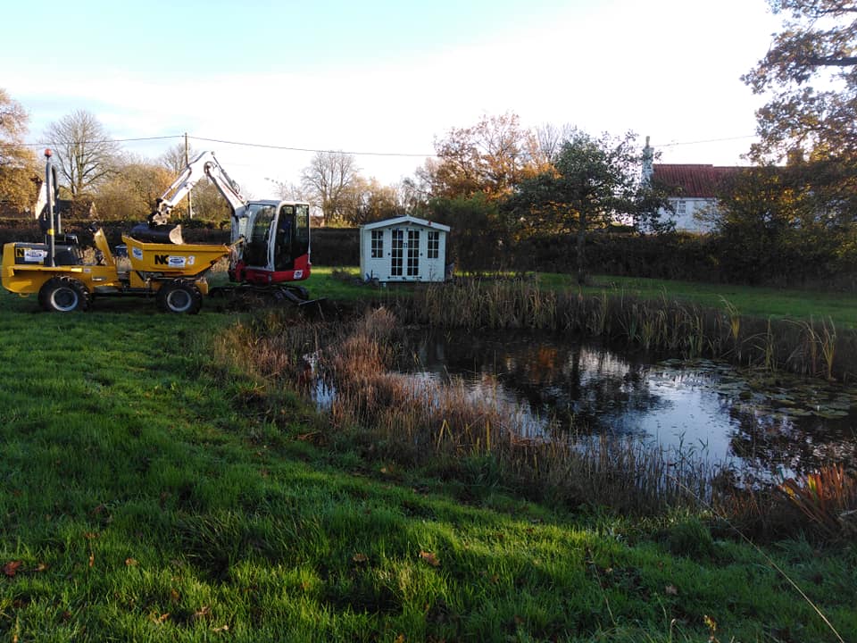 Natural pond in the process of being dredged