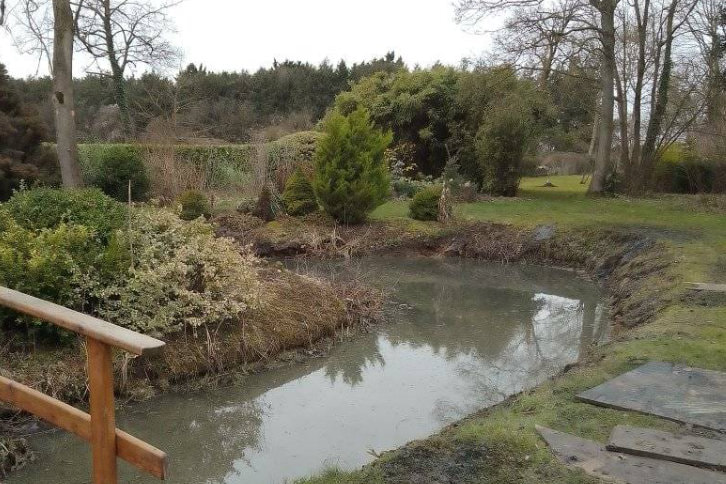 A freshly restored natural pond which has undergone shoreline stabilisation